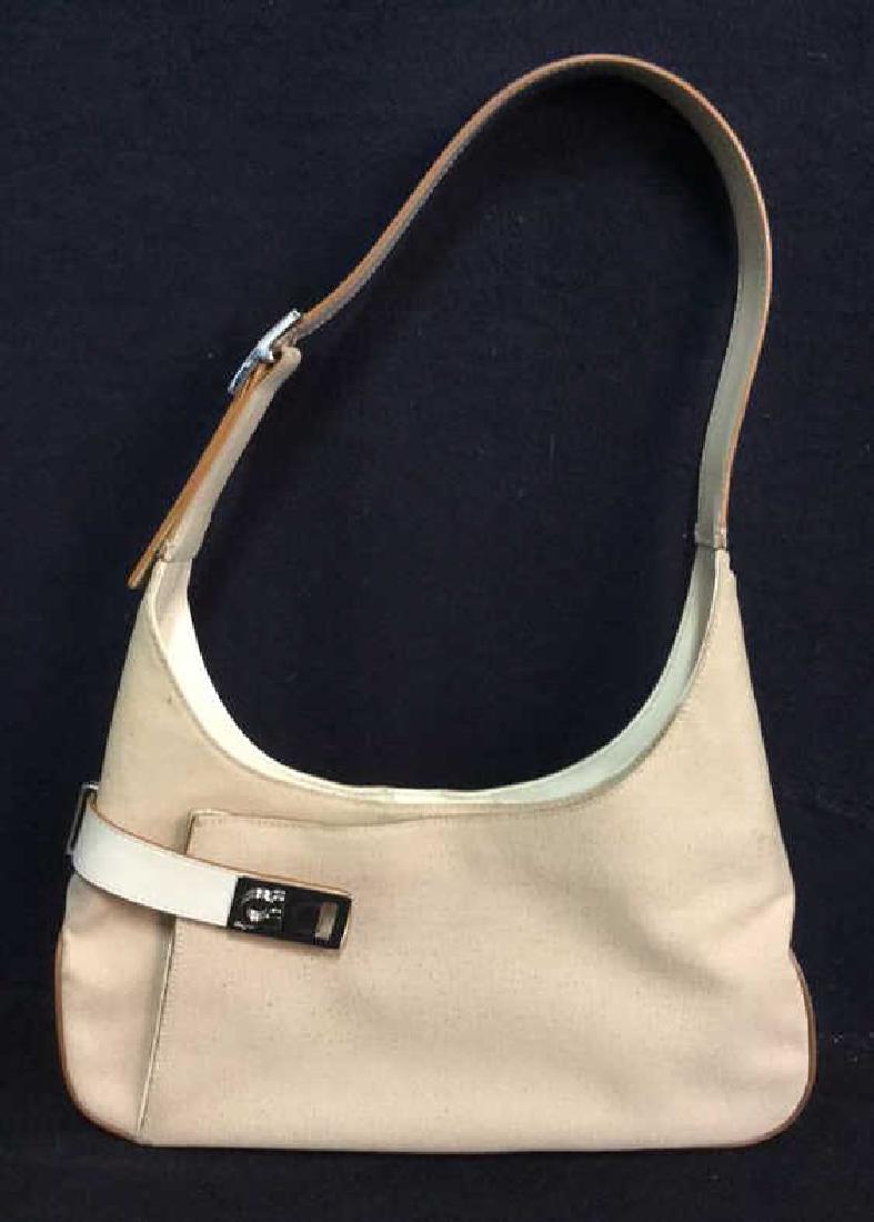 Vintage Hand Bag Marked Salvatore Ferragamo: Vintage Hand Bag Marked Salvatore Ferragamo. Beige Colored canvas outer material with leather like straps and silver toned metal buckles. Buckles and facets all marked with Ferragamo engraving. Interi