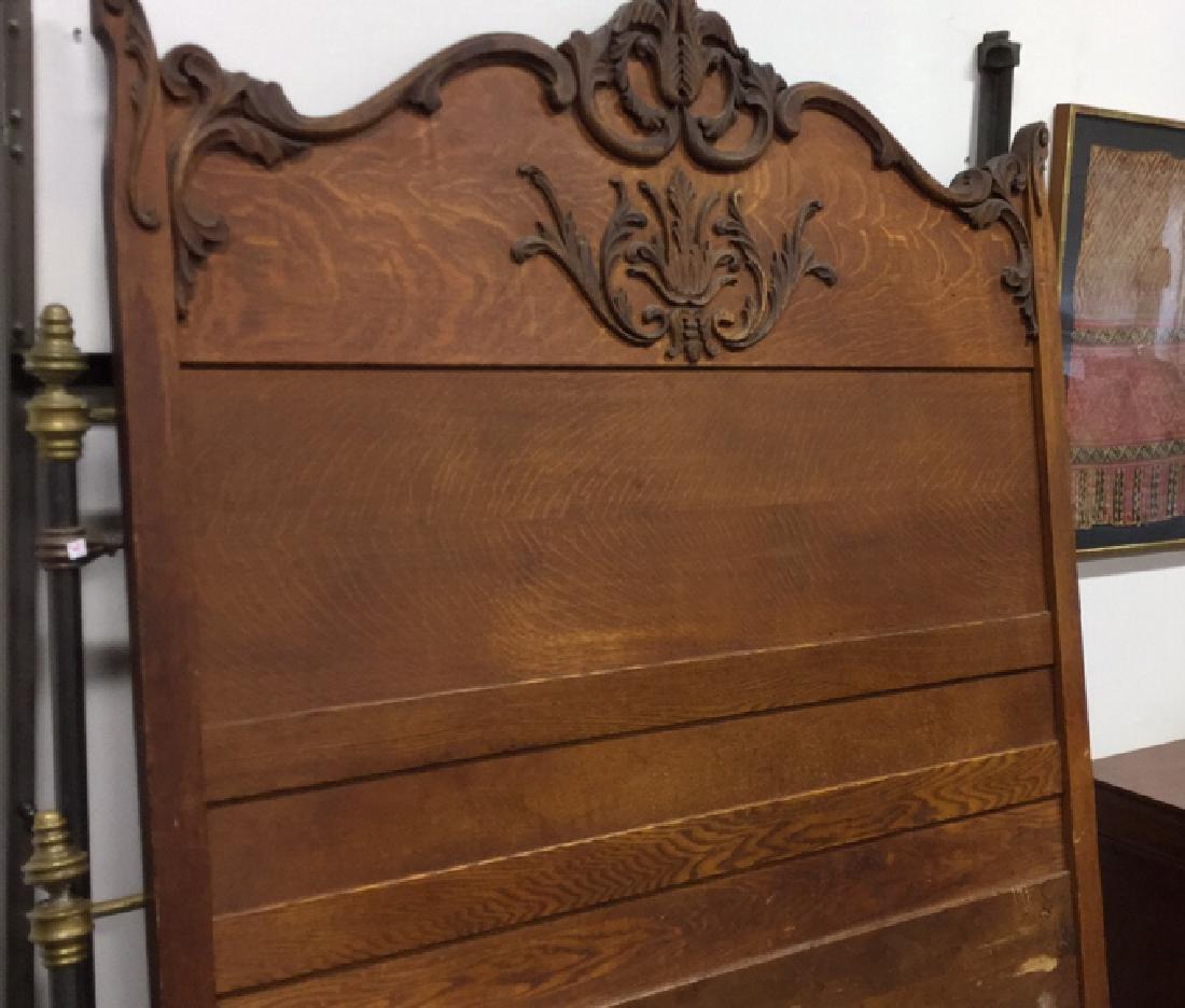 Vintage Carved Wood Headboard: Vintage, possibly antique, wood paneled headboard with decorative carvings at top of piece. Measures approx 78 inches inches H x 57 inches W. Some wear at bottom. Property of a Bedford horse farm.