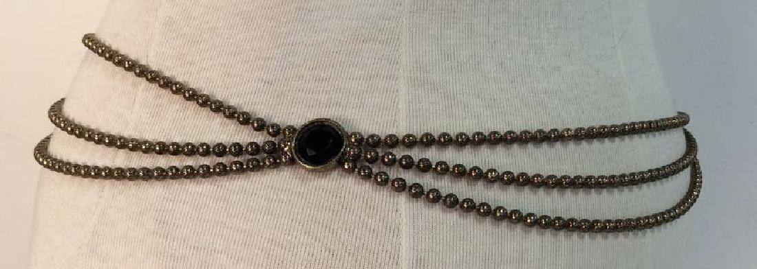 Vintage Metal Belt W Faux Stone: Vintage Metal Belt W Faux Stone. Women’s vintage belt, silver toned metal ball chain with black toned geometric cut faux stone details, Measures approx 30 in long.