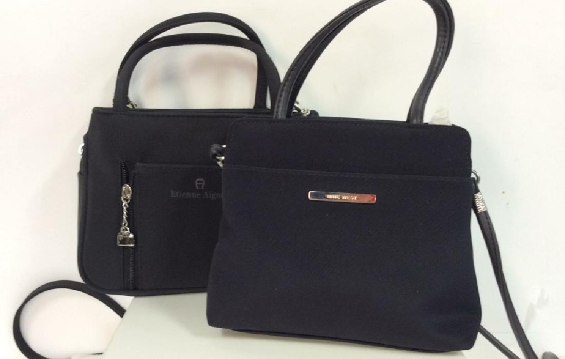 Lot 2 Fabric Purses W Straps: Lot 2 Fabric Purses W Straps. One NINE WEST navy toned fabric purse, one ETIENNE AIGNER black toned, both purses have removable cross body straps, one made of faux leather. Purse bodies measure approx