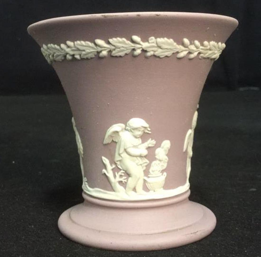 Wedgwood Jasperware Flower Vase: Wedgwood Jasperware Flower Vase. Wedgwood Jasperware porcelain fluted vase in Lilac and white porcelain. Lilac background with raised white porcelain figures of cherubs and a decorative garland around