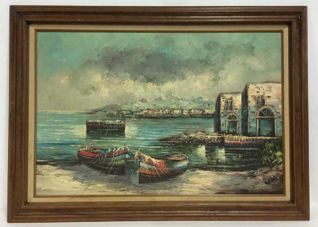 Framed Oil Seaside Landscape Painting: Framed Oil Seaside Landscape. Framed oil painting on canvas, depicts two raw oats in the foreground next to a few small brick buildings, with the seaside town in the background. Some discoloration on 