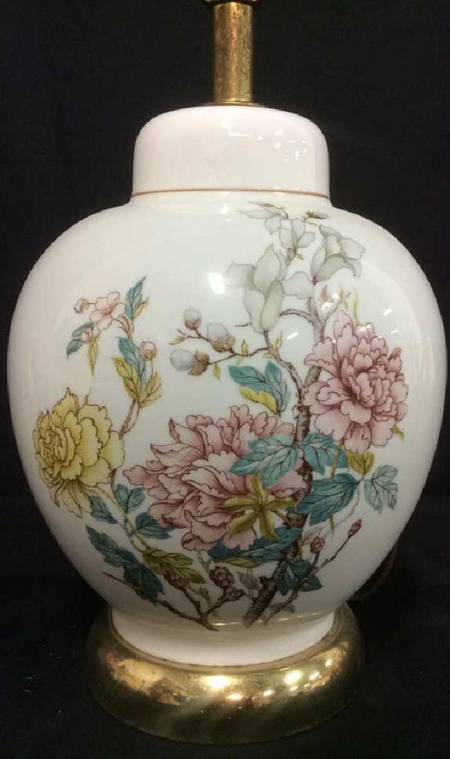 White Toned Floral Detailed Glass Lamp: White Toned Floral Detailed Glass Lamp. Ginger Jar Shape, Floral detail contains tones of pink, yellow, aqua, maroon, and grey. Does not include shade or finial. Measures approx 25 inches tall 9 inche