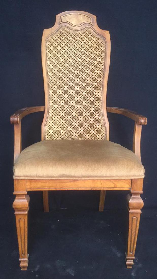 Carved Wooden Caned End Chair: Carved Wooden Caned End Chair. Chairs is light brown toned with light brown toned cushion. Some minor chips and scratches present. Caned end chair, carved end chair, wooden end chair, cushioned end ch