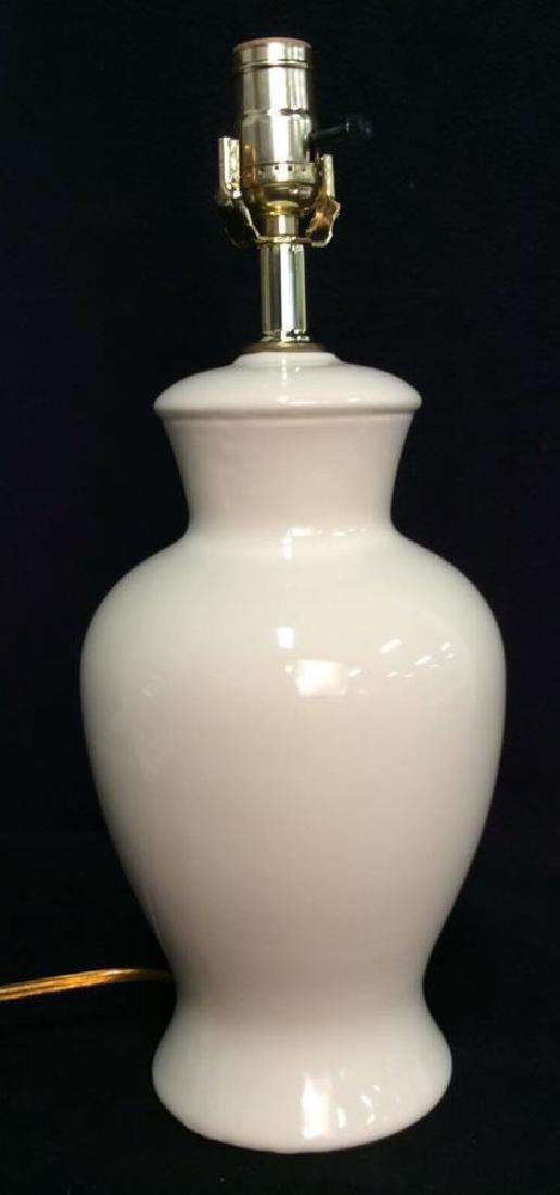 Beige Toned Porcelain Bodied Lamp: Beige Toned Porcelain Bodied Table Lamp. Jar shaped table lamp. Measures approx 17 in tall by7 in in diameter.