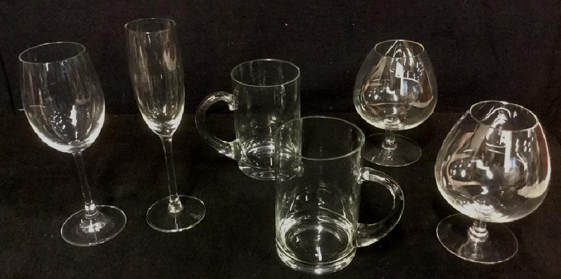 Lot 6 Mixed Crystal And Glass Barware: Lot 6 Mixed Crystal And Glass Barware. Holiday entertaining. Two snifter, two beer mugs, one wine and one champagne glass. No condition issues noted. Beer mug measures approx 5.5 inches h x 5 inches w