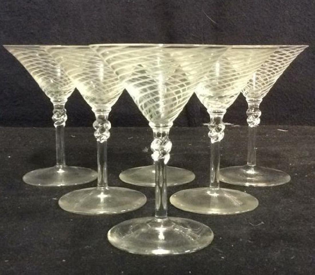 Lot 8 Spiral Detailed Cordial Glasses: Includes 8 cordial glasses. Contains spiral pattern relief detail. Possibly hand made. Glasses have slight variations in size. Measures approx 4.5 inches tall 3.5 inches wide. Bar Ware, Cocktail Glass