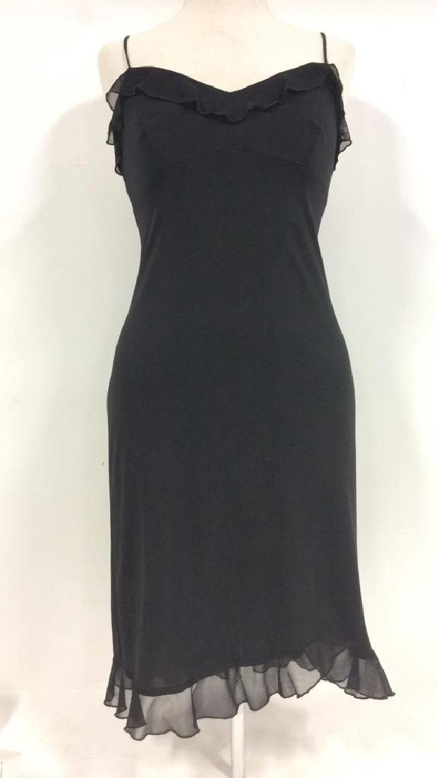 NEXT UP Black Cocktail Dress: NEXT UP Black Cocktail Dress. Women’s designer vintage fashion. NEXT UP, polyester, sized Medium. Spaghetti strapped black cocktail dress with shear fabric ruffles on hem and collar. Measures approx