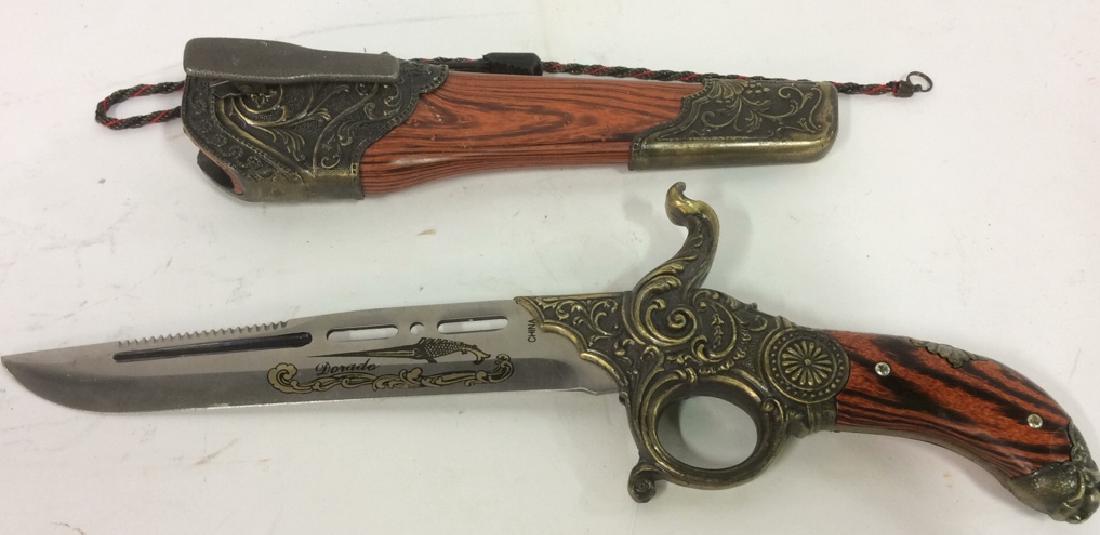 DORADO Intricately Detailed Knife & Knife Cover: Includes knife and knife cover. Contains intricate ornate gold toned detail. Has faux paint wood detail. Has clip on one side of cover. Knife is shaped like old western firearm. Measures approx 12 inc