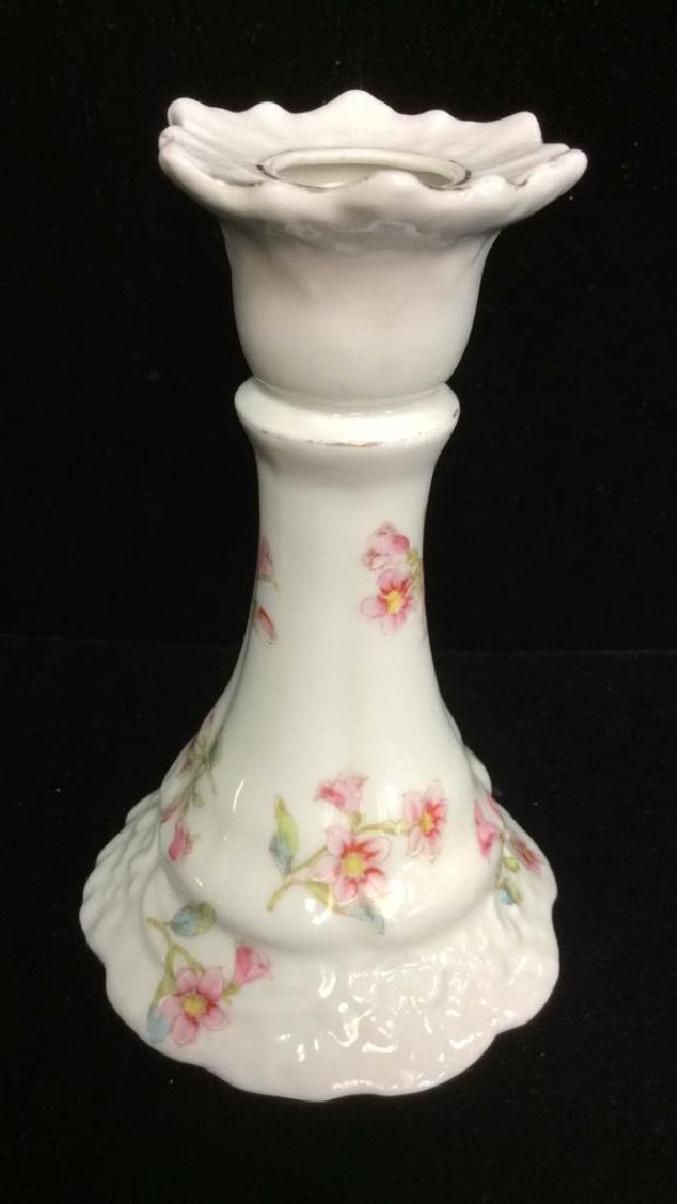 SPRAY CARLSBAD Porcelain Candlestick: SPRAY CARLSBAD Porcelain Candlestick. White toned textured porcelain with pink toned painted floral pattern with gold toned metallic rim details. Marked on bottom as SPRAY CARLSBAD. Measures approx 6 