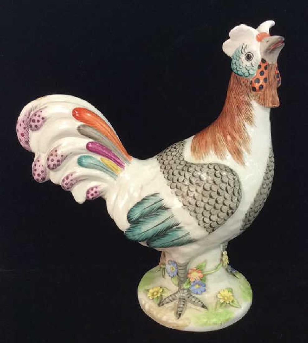 Italian Mottahedeh Porcelain Rooster Statuette: Italian Painted Porcelain Rooster Statuette. White toned porcelain with multicolored black, blue, pink, red and orange toned design. Circular porcelain base is decorated with sculpted porcelain painte
