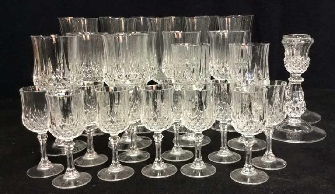 Set 32 Heavy Predsed Crystal Stemware: Set 32 Heavy Predsed Crystal Stemware. Stemware with round edges, cut diamond shaped design and shaped stems, also comes with matching candlesticks. Cordials, wine glass, martini glass. Largest piece 