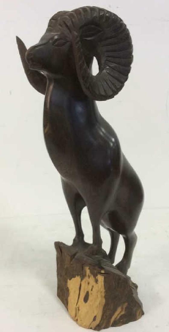 Hand Carved Wood Mountain Goat Sculpture: mountain goat with ridged curled horns stands profundity on mountain slope, apparently unsigned measures ht app 19 inches by app 7 inches width and depth 6 inches
