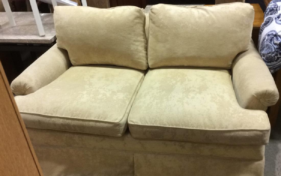 Pale Yellow Toned Textured Loveseat: Loveseat is Banana Creme Toned. Loveseat is skirted. Contains modern art textured fabric. Yellow Loveseat, textured loveseat , skirted loveseat. Living room furniture. In good condition. Contains 4 wo