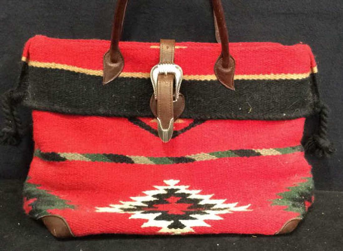 Navajo Caroet Style Duffel Carry Bag: southwestern style, heavy woven fabric, possibly wool, southwestern design, belt buckle with silver toned trip edging and carry straps, measures app 12 by 18 inches, tote bag, satchel, southwestern ar