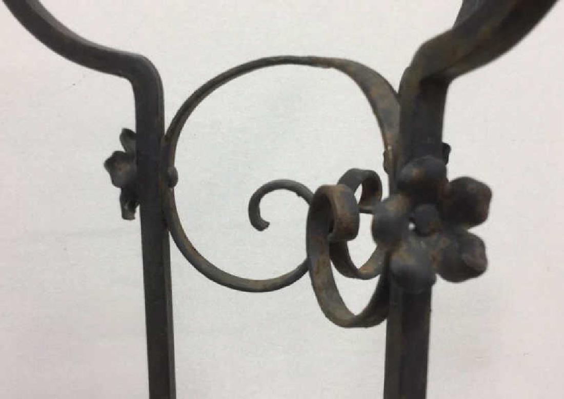 Curled Iron Tall Plant Stand Vintage: vintage possibly antique scrolled iron or metal plant or display stand, rings for hanging lower plant holder and upper center holder, vintage possibly antique measures ht 58 inches diameter app 13 inc