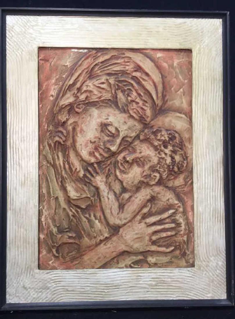 Vintage Plaster Mother and Child Framed Art: Sculpted Plaster Mother and Child Framed Art. Appears to be plaster artwork signed Friedman '62. Earth toned, brown and orange toned dimensional artwork. Framed in black and beige toned painted frame.