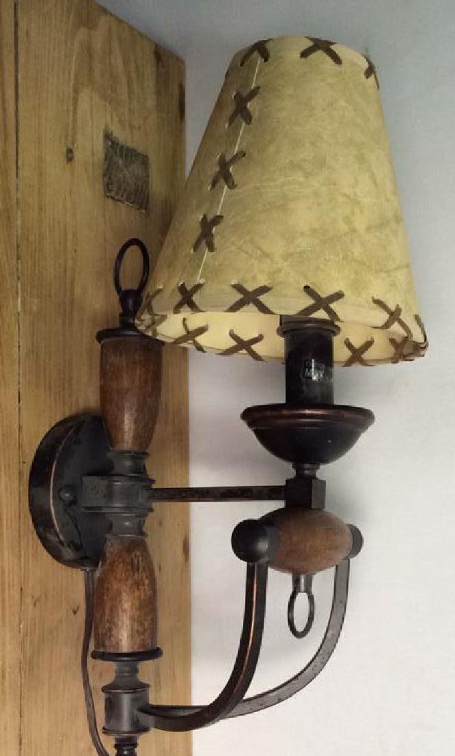 Wall Mount Electrical Lamp Wall Sconce: Wall Mount Electrical Lamp. Wood and metal bodied lamp. Mounts to wall, with electrical cord. Some minor surface wear. Measures approximately 20 in tall by 8 in wide by 11 in deep. Property of Pound R