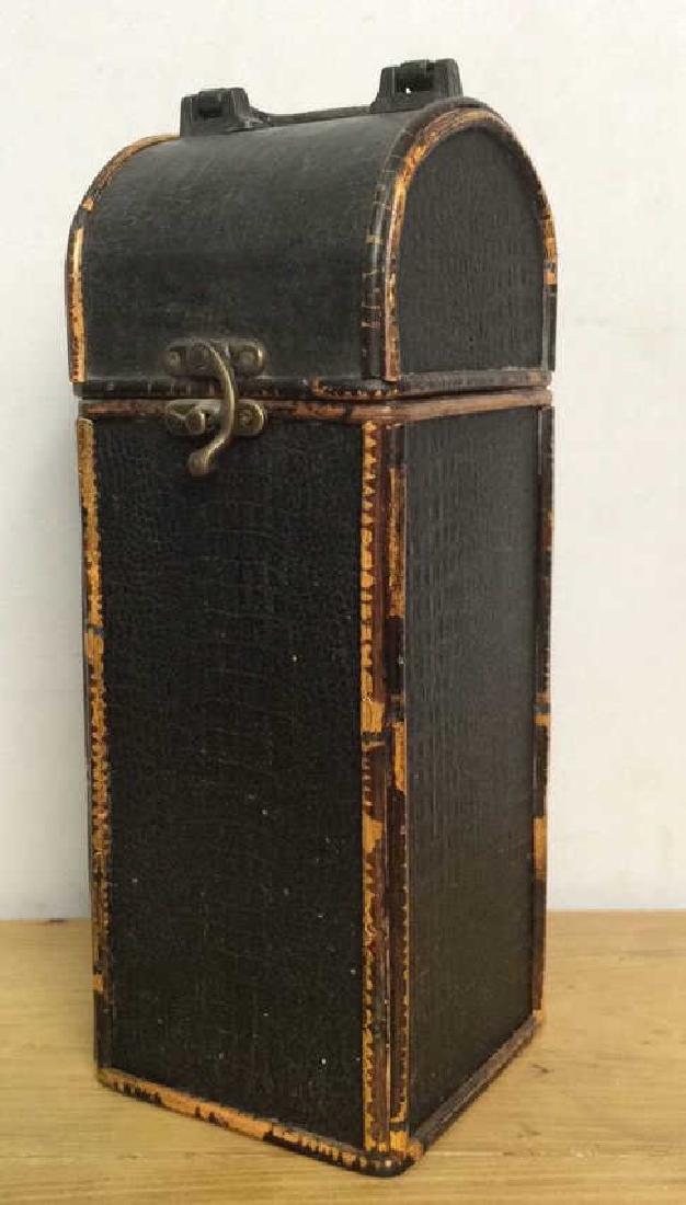 Black Toned Leather Style Lidded Box: Black Toned Leather Style Lidded Box. Possibly genuine leather possibly faux, hinged lidded box. Wine box, display, supply box. Some wear to trim. Measures approx 26 in tall by 6 in long by 5 in wide.