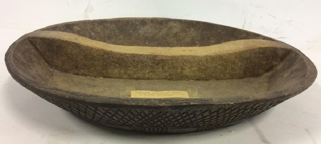 Antique Ethiopian Bowl From Kaffa Province: Label reads ANTIQUE ETHIOPIAN BOWL FROM THE COFFEE COUNTRY IN KAFFA PROVINCE. Bowl is Brown toned. Measures approx 16 inches diameter 2.5 inches tall. Contains hand carved detail. Antque hand carved. 