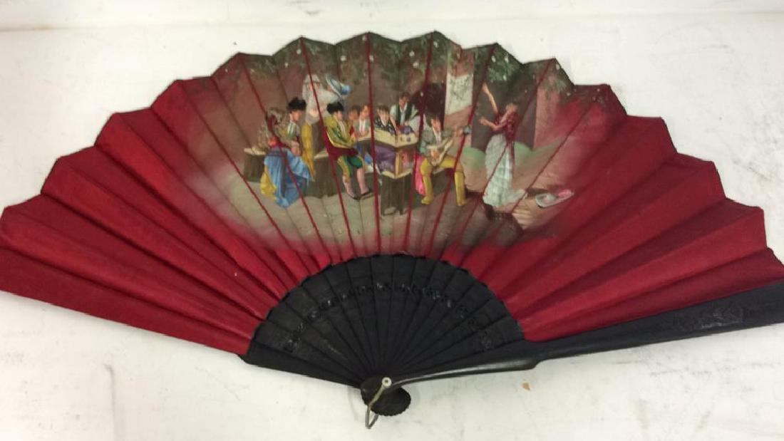 Vintage Antique Spanish Painted Silk Fan: Vintage Antique Spanish Painted Silk Fan. Carved black toned wooden body with intricate etched floral filigree design and openwork filigree style detail. Red toned silk fabric with hand painted scene 
