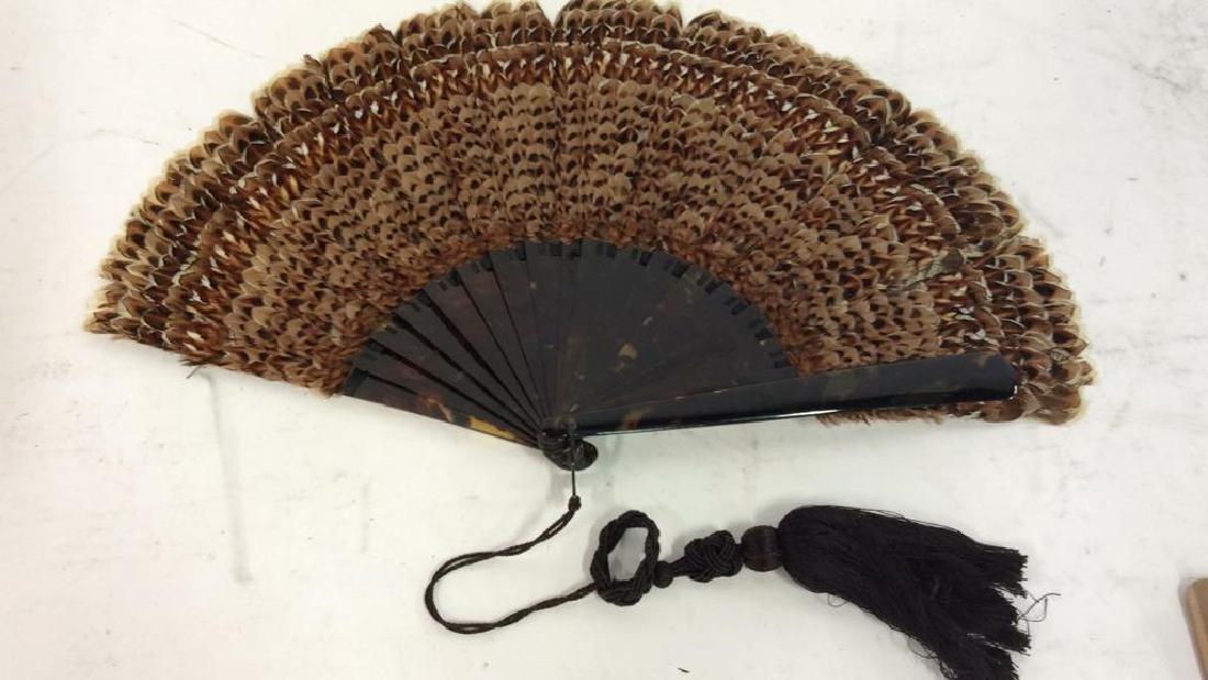 Vintage/ Antique Feathered Ladies Fan: Vintage Possibly Antique Feathered Ladies Fan. Possibly vintage or antique, ladies fan with Lush black toned bird feathers and faux shell body, possibly bakelite or celluloid. Measures approx 11 in ta