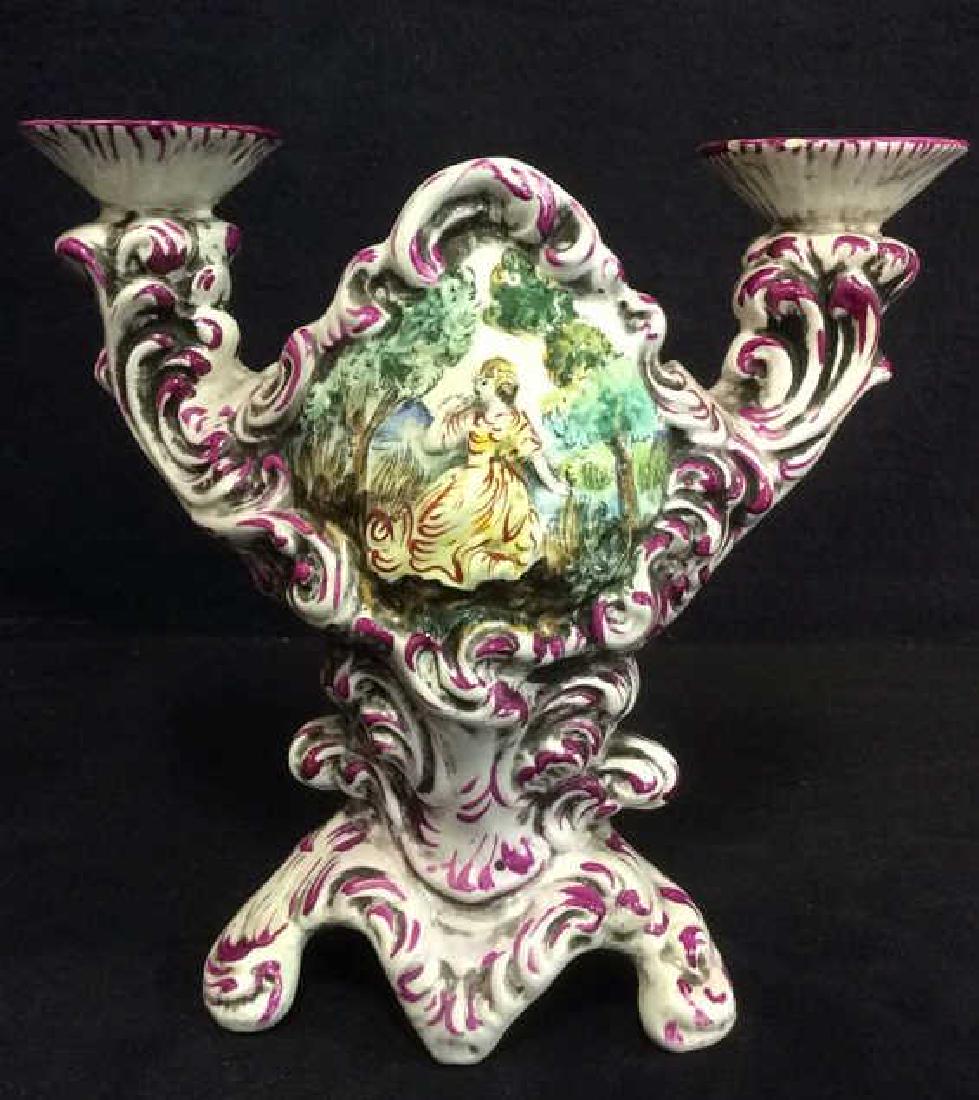 Vintage Italian Handpainted CAPODIMONTE Candelabra: Piece is marked CAPODIMONTE on underside. Candelabra is Italian. Piece is vintage possibly antique. Candelabra is porcelain and hand painted. Depicts a woman in a yellow dress in the woods. Contains b