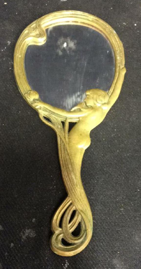 Art Nouveau Female Nude Form Hand Mirror: dresser top accessory, vanity mirror, vanity dresser top, form of female and sinuous lines Art Nouveau, arts and crafts, metal surround to mirror, measures 10 inches length, property of Bedford New Yo