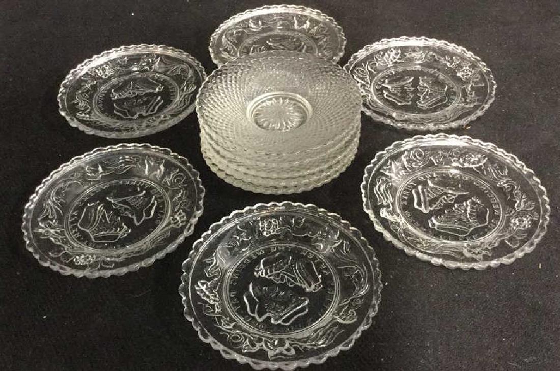 Lot 11 Miniature Cut Glass Saucers: Lot includes 11 miniature saucers. 6 saucers have beveled detail of 2 heads and text that reads "And Three Weeks After The Wedding Day" Each piece measures approx 3.5 inches wide.