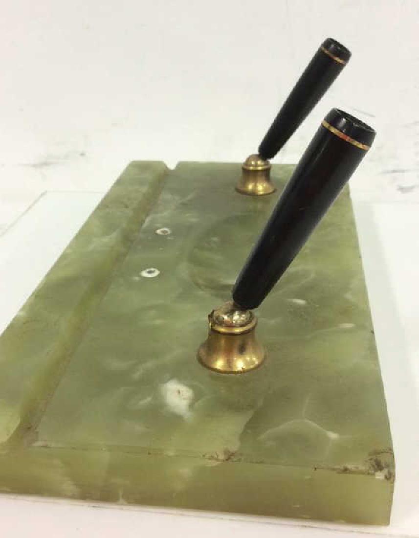 Green Toned Onyx Dual Pen Holder: Green Toned Onyx Natural Stone Dual Pen Holder. Brass toned metal ball jointed pen holders, appears to have once had a plaque. Some minor surface wear and discoloration, some minor chips in base. Meas