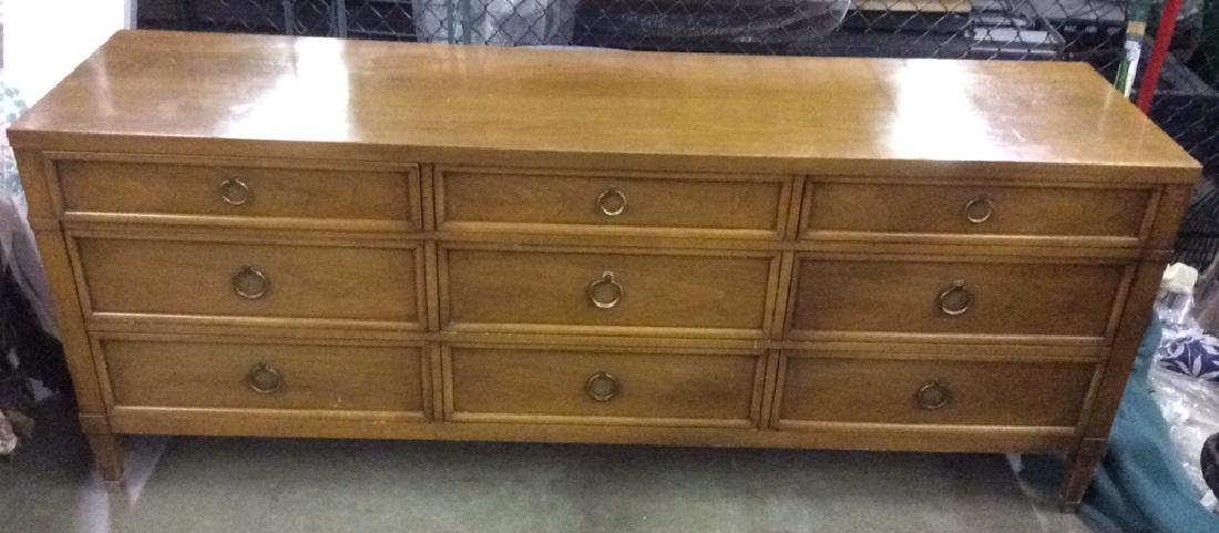 MILLING ROAD FURNITURE Vintage Wooden Dresser: Dresser is wooden. Has 5 legs. Appears to be vintage. Contains 9 drawers. Each drawer has gold toned metal handle. Marking inside upper right drawer reads MILLING ROAD FURNITURE A DIVISION OF BAKERS F