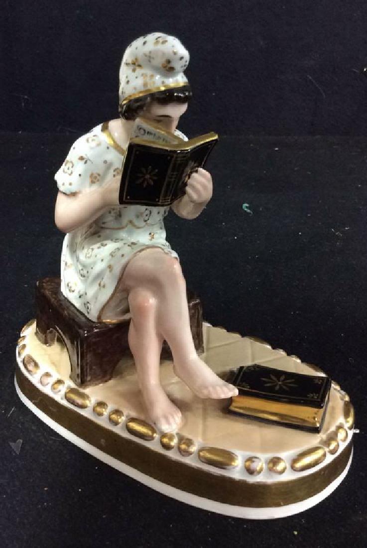 LIPPERT & HAAS IN SCHLAGGENWALD Porcelain Figure: Depicts woman reading. Measures approx 6 inches tall 6 inches long, 4 inches wide. Marked 841. Gold tones around base. Contains minor chips. Otherwise no other condition issues noted.