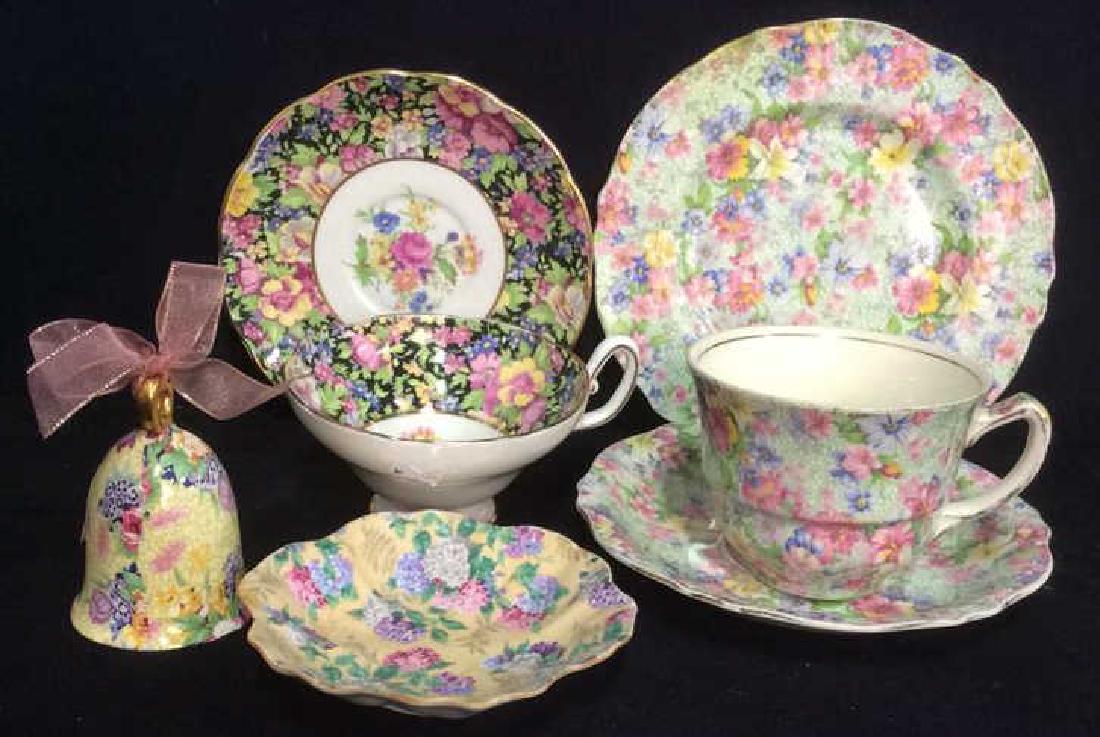 Group Lot English Chintz Porcelain Table top: includes set of tea cup saucer dessert plate diameter 7 inches and marked RD 1981, Royal Winton, Made in England Marion, A, 114, cup ht 3 inches some wear to rim, tea cup and saucer marked CLARE Bone