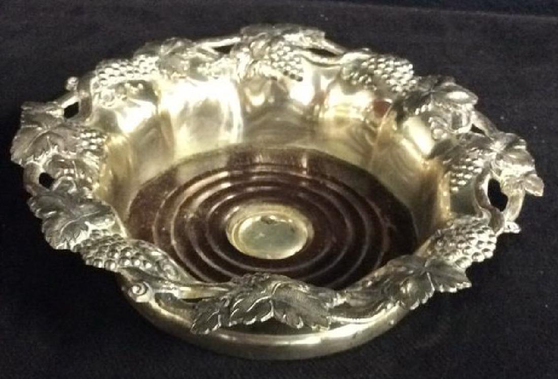 Vintage WoodGrape Motif SP Coaster: vintage possibly antique silver plate wine coaster with wood base, repoussé chased open frettework vi e leaf and bunches of grapes motif, measures diameter app 7.5 inches ht app 2.5 inches