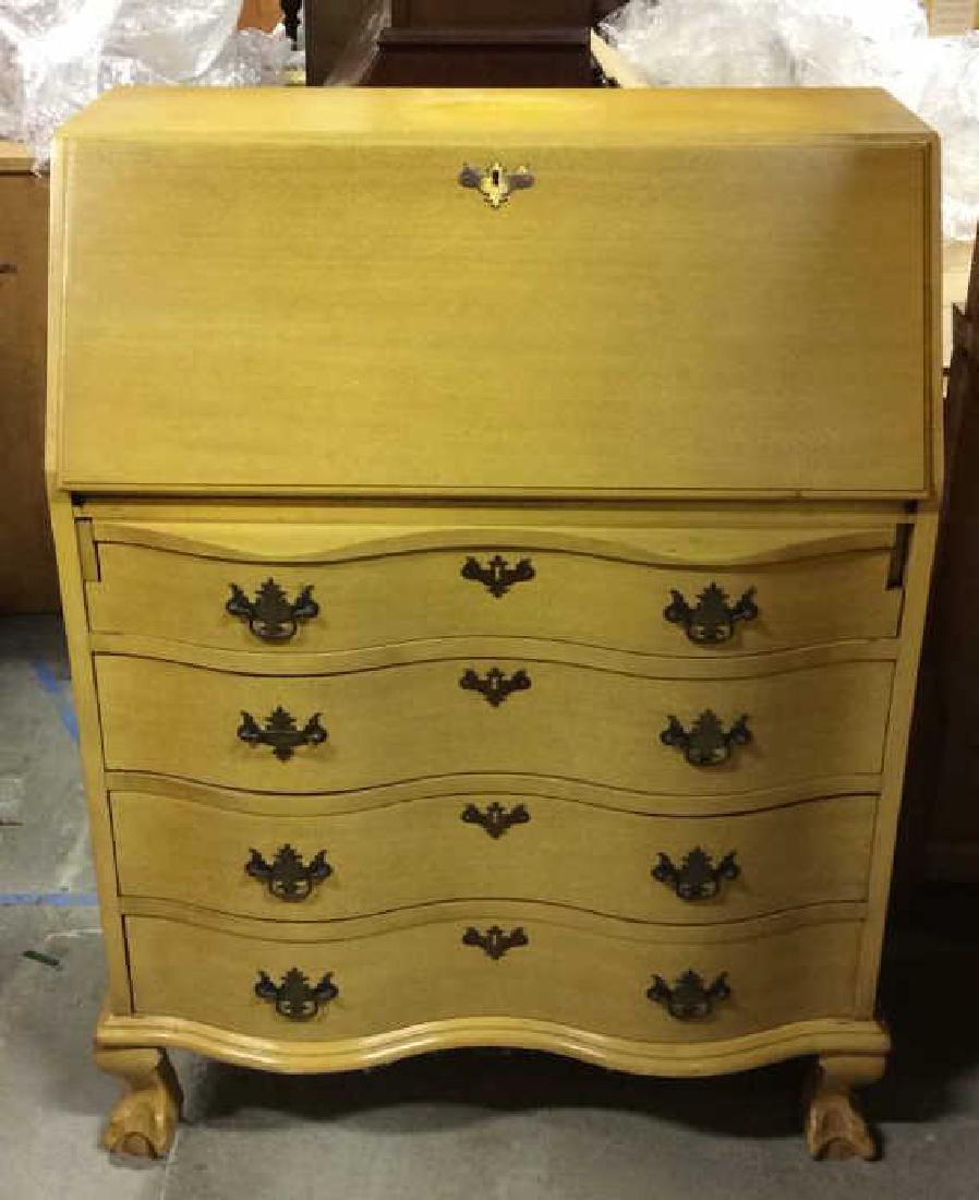 Carved Wood Drop Front Writers Desk W Drawers: Piece has dark yellow tone. Contains 4 dual handled drawers and flip down desk with keyhole. Does not include key, flip down desk mechanism does not lock. Appears to be vintage. Contains some fading a