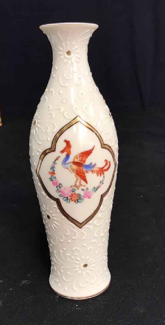 Noritake Textured Painted Porcelain Vase: With blue and burnt orange toned painted plumed bird in gold painted center medallion, measures ht app 9 inches, good condition, marked as hand painted, marked Japan