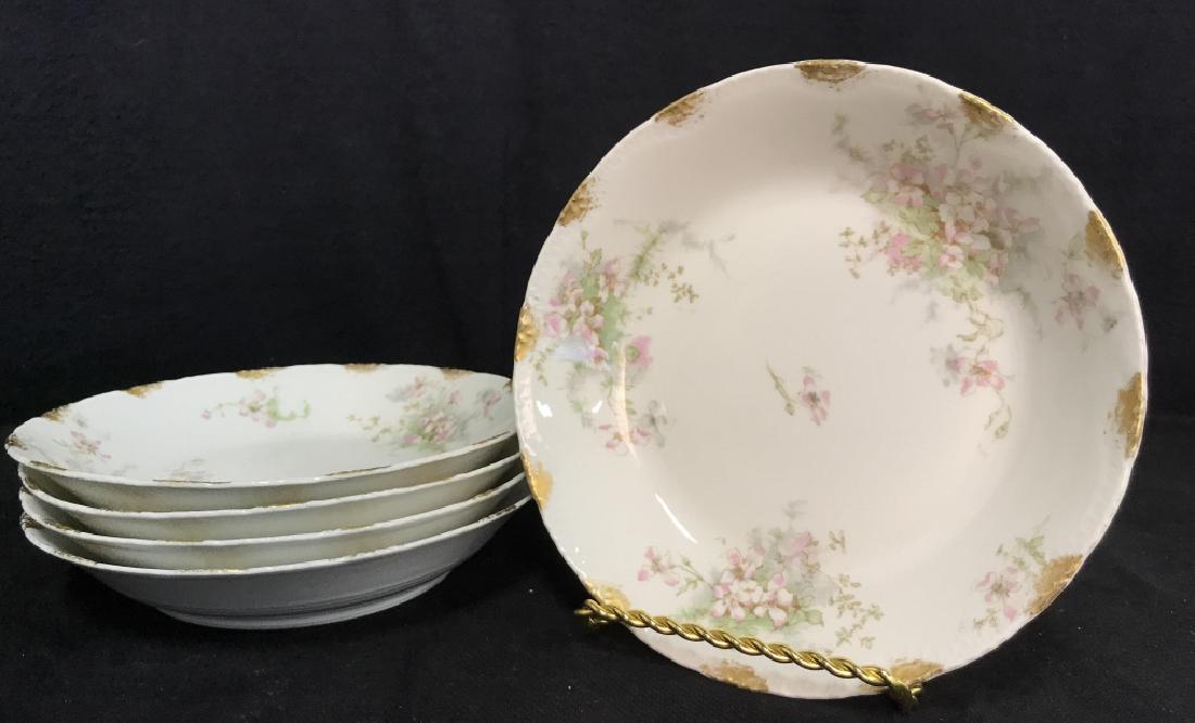 Set 5 LIMOGE TheodoreHaviland French Soup Bowls: Set 5 LIMOGE TheodoreHaviland French Soup Bowls. White toned fine china/porcelain with pink toned floral pattern design with gold toned details. Measures approx 8 in in diameter by 1 1/2 in deep. Some