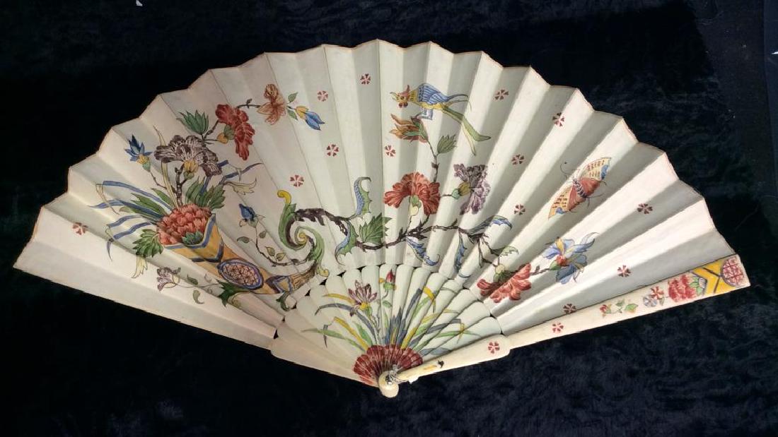 Vintage/Antique Bone and Fabric Fan: Vintage/Antique Bone and Fabric Fan Front face of fan appears to be thin white toned leather painted with oriental inspired floral scene with birds and butterflies. Reverse fan is off white fabric, mo