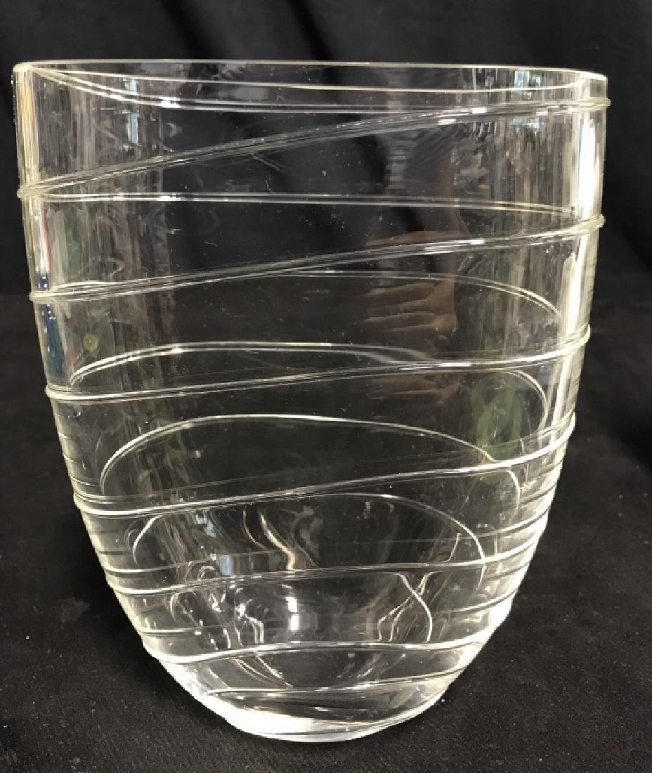 Art Glass Crystal Vase Bowl Vessel: Art Glass Crystal Vase. Vintage Art Glass Crystal Vase. An oblong crystal vase with ribbed lined design. No condition issues noted. Measures approx 8 inches tall x 6 inches wide x 3.5 inches deep.