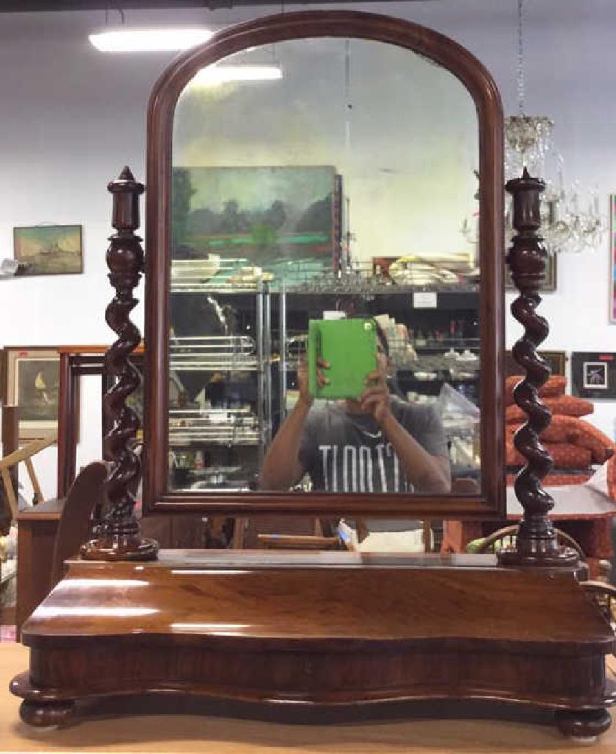 Carved Antique Rotatable Dresser Top Mirror: Antique Dresser top Mirror, Carved with barley twist form sides, central mirror flips up down, rotatable brown toned wooden dresser top mirror with swirled support beams on each end. Contains a shrink
