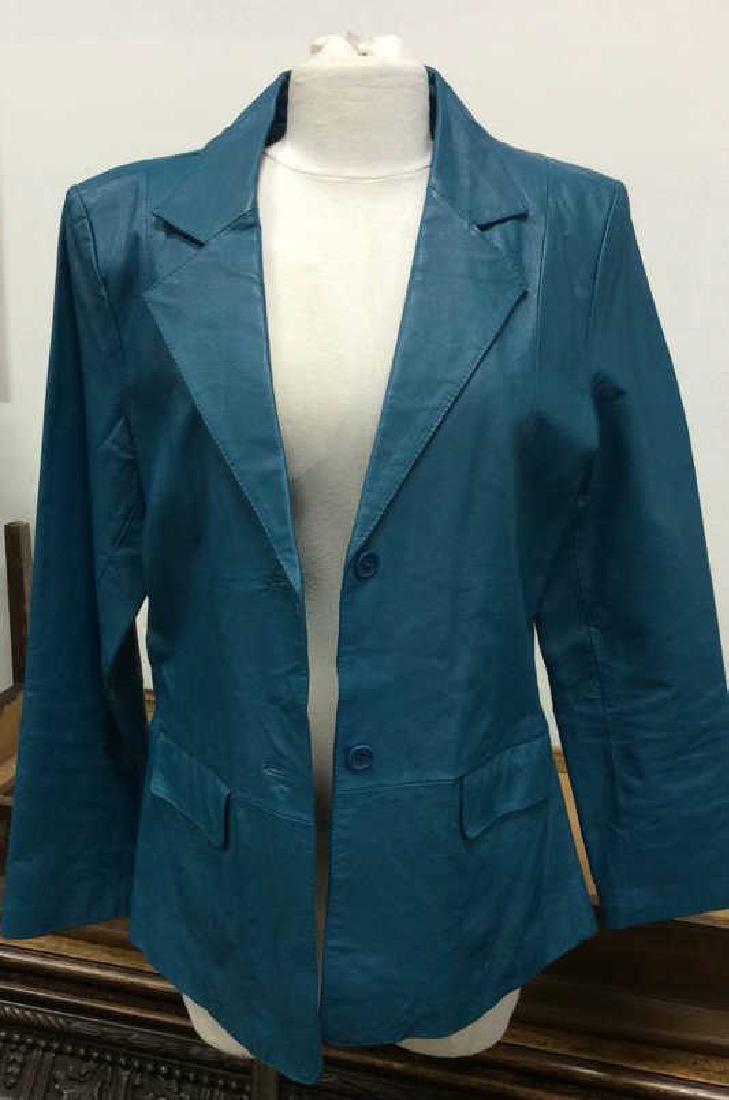 CHADWICKS Leather Blue Toned Blazer: CHADWICKS blazer is blue toned leather with polyester lining. Collared jacket and 2 buttons down the middle, Women’s size 14 measures 18 inches wide, 26 inch sleeve length.