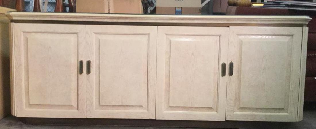 HENREDON Cream Toned Console Cabinet: Cabinet contains cream toned & glass top. Contains 4 cabinet doors with gold toned handles. Left half of cabinet contains 3 drawers. Right side has shelf space. Marking on right side of top drawer rea