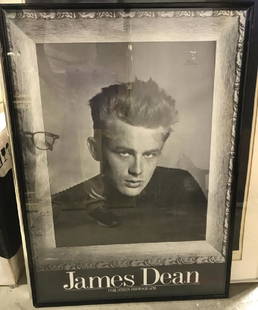 Phil Stern Framed Poster of James Dean: Framed poster of American actor and cultural icon James Dean in black and white taken by Phil Stern (1919-2014 who was known for taking iconic portraits of Hollywood Stars. The piece is inside of a bl