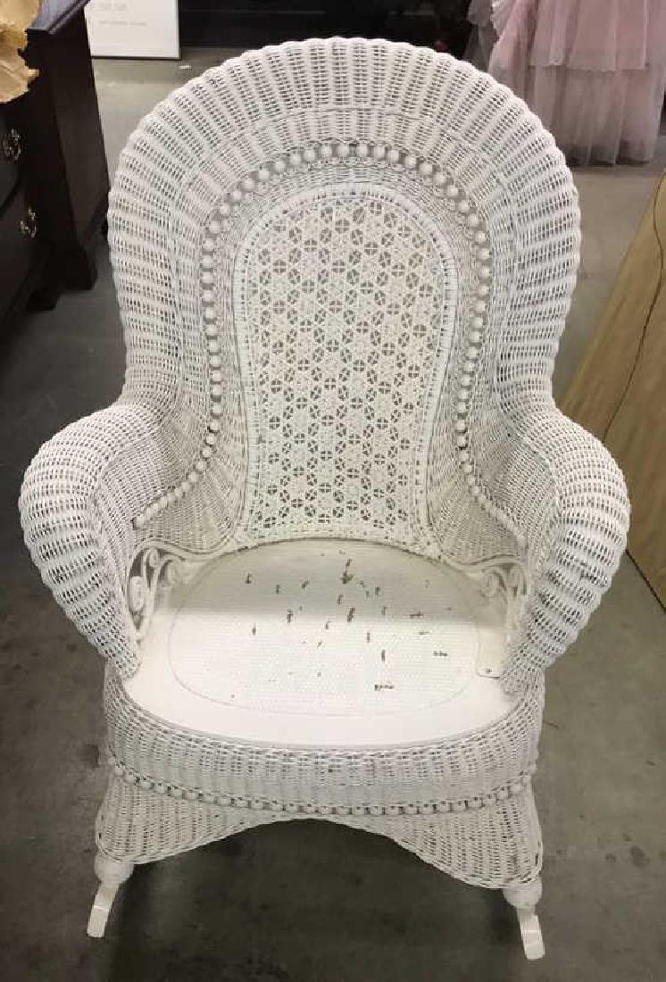 Vintage Detailed White Toned Whicker Rocking Chair: Vintage Possibly Antique White Toned Whicker Rocking Chair. Back has woven pattern framed by wooden beaded details. Rich Scroll Work, Measures approx 37 in tall by 27 in long by 32 in wide. Some minor