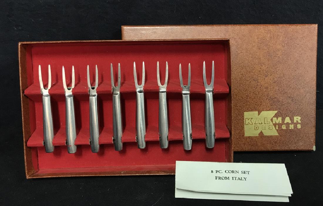 Set Of 8 Kalmar Designs Corn Set From Italy: Set Of 8 Kalmar Designs Stainless Steel Corn Holder Set From Italy. Hors Deoeuvre forks. Cocktail Forks. Forged of stainless steel with hand buffed satin finish. No condition issues noted. Comes in or