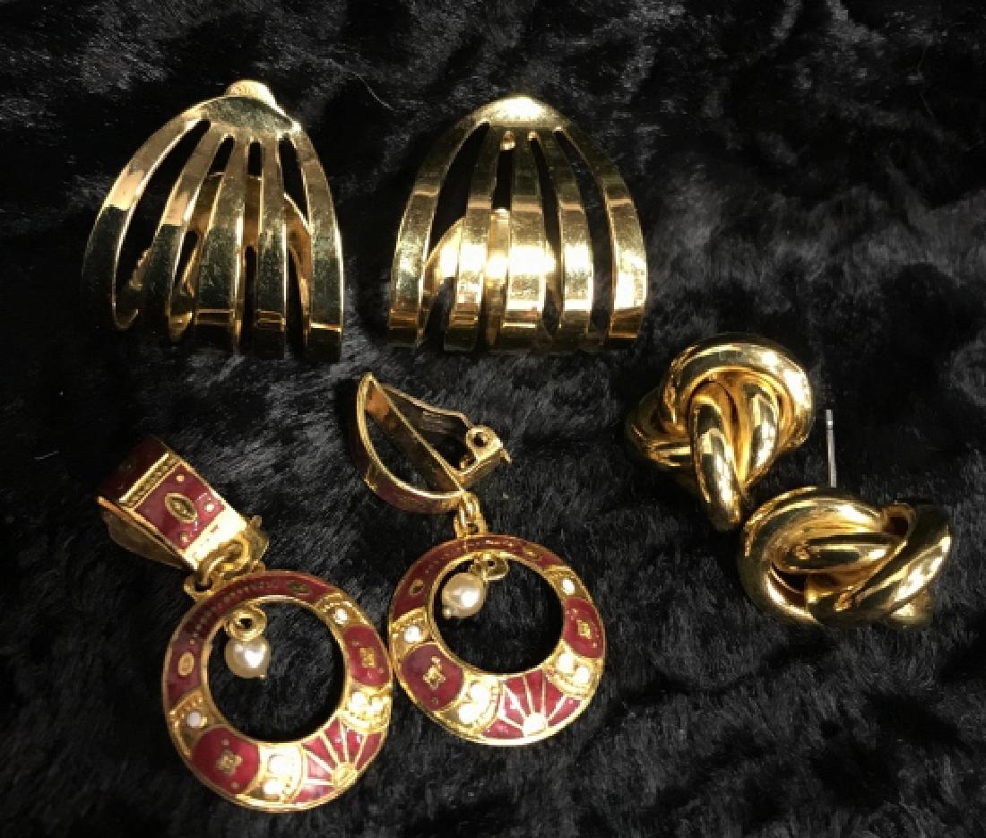 Lot 3 Women's Vintage Costume Jewelry Earrings: Lot 3 Women's Vintage Costume Jewelry Earrings. One pair of pierced earrings with curved gold toned metal bodies, earring backs marked MONET. One pair pierced earrings with gold toned knot design. One