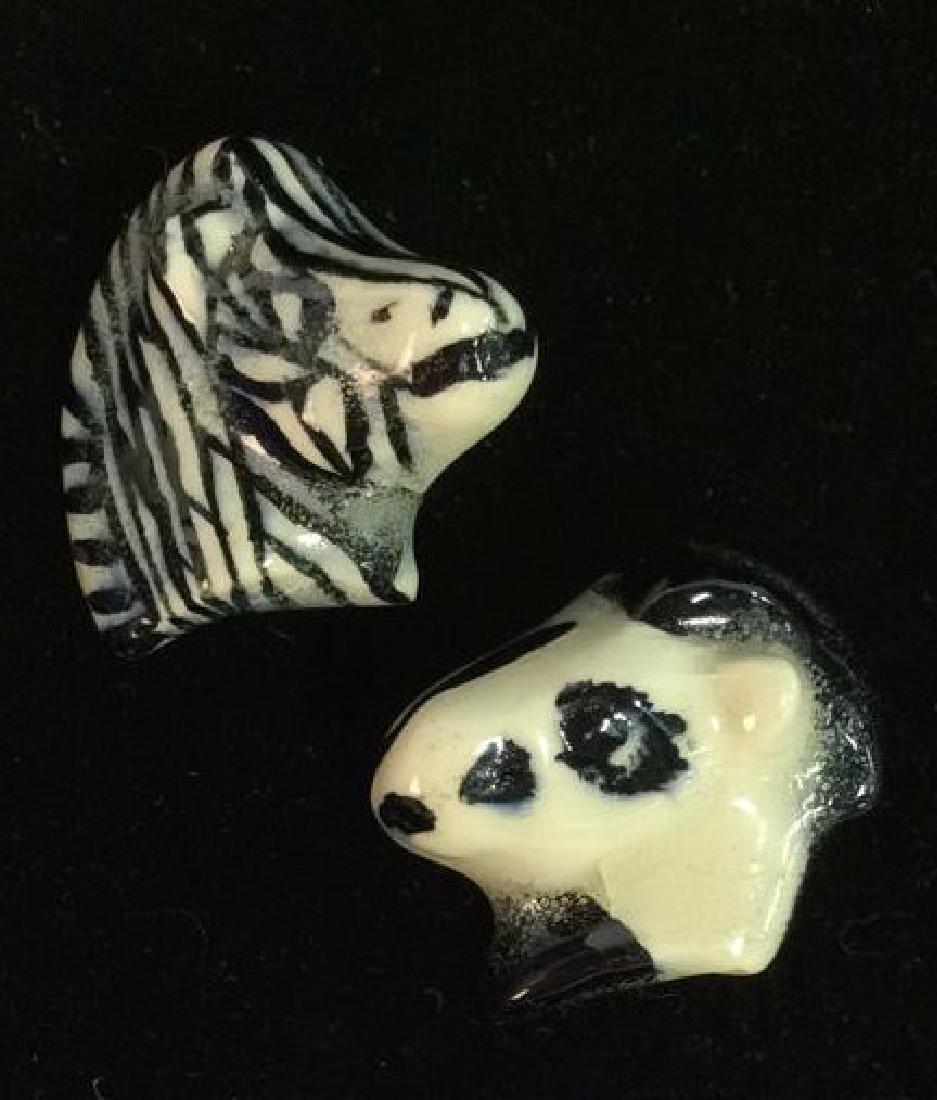 Pair Ceramic Horse and Zebra Brooch Pins: Pair Ceramic Horse and Zebra Brooch Pins, women’s vintage estate jewelry. Two ceramic brooch pins, both black and white toned painted pins, one depicts a horse head and the other a zebra. Measures a