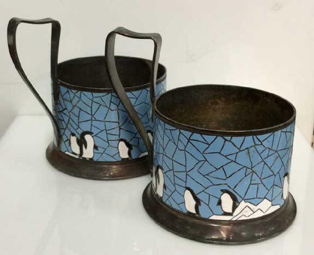 Pair Silver Toned Metal Penguin Mosaic Holder: Pair Silver Toned Metal Penguin Mosaic Glass Holder. Metal glass holder with handle, meant hold a small drinking glass. Vintage glass holder decorated with mosaic penguin illustration. Appears to be S