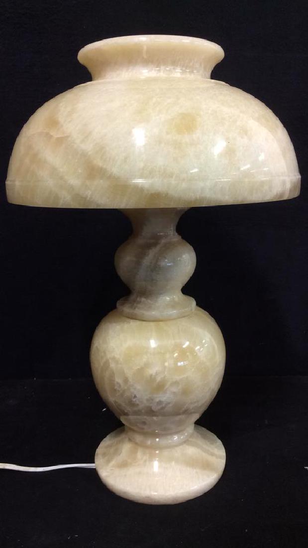 Cream Toned Alabaster or Marble Lamp: Lamp is cream toned. Possibly marble but has not been tested. Piece contains unique banding patterns. Lamp does separate into 3 separate pieces. Bulb socket is slightly crooked. Lamp has not been test
