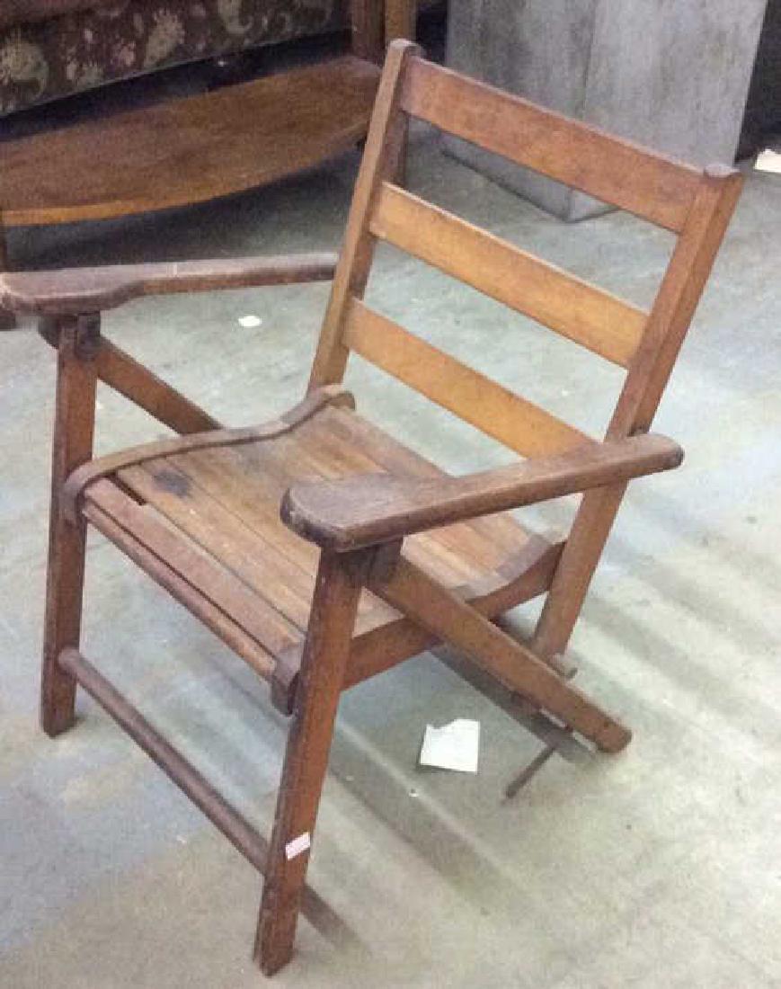 Antique Folding Wooden Doll or Child Chair: Vintage possibly antique, Brown toned wooden folding doll or child armchair. Contains scratches and ware. Measures approx 21 inches tall x 16 inches wide and deep. hand crafted wood slatted chair, pad